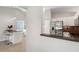 Kitchen pass through view with counter seating, stainless steel appliances and granite counter tops at 3413 5Th W Dr, Palmetto, FL 34221