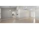Open floor plan from living room to kitchen and dining area with neutral colors at 3413 5Th W Dr, Palmetto, FL 34221