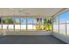 An empty sunroom with multiple windows and a ceiling fan at 3413 5Th W Dr, Palmetto, FL 34221