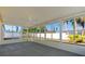 An empty sunroom with multiple windows and a ceiling fan at 3413 5Th W Dr, Palmetto, FL 34221