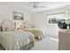 Bedroom with two twin beds, ceiling fan, and lots of natural light at 3786 Surrey Ln, Sarasota, FL 34235