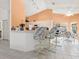 Open breakfast bar with seating and views to the sunny outdoors at 3786 Surrey Ln, Sarasota, FL 34235