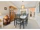 Bright dining area with neutral tones, a modern light fixture, and view to the backyard at 3786 Surrey Ln, Sarasota, FL 34235