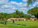 Scenic view of a golfer practicing on a driving range with well-maintained greens at 3786 Surrey Ln, Sarasota, FL 34235