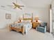 Vaulted ceiling bedroom with ceiling fan and ensuite bathroom at 3786 Surrey Ln, Sarasota, FL 34235