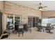 Spacious covered patio featuring an outdoor bar area with a ceiling fan for maximum comfort at 3786 Surrey Ln, Sarasota, FL 34235