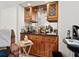 Convenient wet bar with ample storage, cabinetry, and recessed lighting at 3786 Surrey Ln, Sarasota, FL 34235