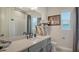 Stylish bathroom featuring a marble countertop vanity and sleek fixtures at 3811 158Th Avenue E Cir, Parrish, FL 34219