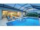 Enjoy a large screened pool with a beautiful view of the yard and a glimpse into the home's interior at 3811 158Th Avenue E Cir, Parrish, FL 34219
