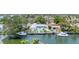 Beautiful aerial view of a waterfront community with canals, homes, and lush greenery, showcasing coastal living at 3941 14Th Ne Ln, St Petersburg, FL 33703