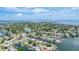 High angle aerial view showcases the city's coastal canal community surrounded by beautiful waters at 3941 14Th Ne Ln, St Petersburg, FL 33703