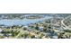 High angle aerial view showcases the city's coastal canal community surrounded by beautiful waters at 3941 14Th Ne Ln, St Petersburg, FL 33703