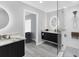 Modern bathroom with double sink vanity, soaking tub, and luxurious walk-in shower at 3941 14Th Ne Ln, St Petersburg, FL 33703