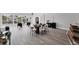 Bright dining area with a modern table, chairs, an island with seating, and views of the outdoor canal at 3941 14Th Ne Ln, St Petersburg, FL 33703