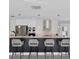 Modern kitchen with a breakfast bar and sleek appliances, perfect for cooking and entertaining at 3941 14Th Ne Ln, St Petersburg, FL 33703