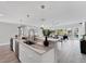 Bright, modern kitchen with marble countertops, stainless steel appliances, stylish lighting, and a view of the outdoor canal at 3941 14Th Ne Ln, St Petersburg, FL 33703