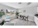 Inviting living space offers water views, a dining table, and comfortable, modern furniture at 3941 14Th Ne Ln, St Petersburg, FL 33703