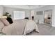 Cozy main bedroom with a soft color palette, a large bed, and a view of the en-suite bathroom at 3941 14Th Ne Ln, St Petersburg, FL 33703