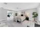 Bright main bedroom features neutral decor and stylish light-colored wood flooring at 3941 14Th Ne Ln, St Petersburg, FL 33703