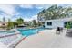 In-ground pool sits within the backyard alongside waterfront canal at 3941 14Th Ne Ln, St Petersburg, FL 33703
