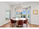Charming dining area with round table, comfortable seating, and bright natural light at 4104 Las Palmas Way, Sarasota, FL 34238