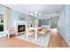 Stylish dining room featuring a fireplace, modern lighting, and elegant decor at 4104 Las Palmas Way, Sarasota, FL 34238