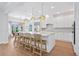 Elegant kitchen with marble countertops, stainless steel appliances, and breakfast bar at 4104 Las Palmas Way, Sarasota, FL 34238