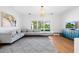 Cozy living room with large windows, comfortable sofa, and stylish decor at 4104 Las Palmas Way, Sarasota, FL 34238