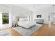 Beautiful main bedroom with a neutral palette and hardwood floors at 4104 Las Palmas Way, Sarasota, FL 34238
