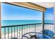 Breathtaking ocean views from this cozy balcony featuring a table and chair set, perfect for relaxing at 4401 Gulf Of Mexico Dr # 907, Longboat Key, FL 34228