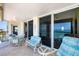 Enjoy the fresh air and ocean breeze on this spacious balcony with comfortable seating and beautiful views at 4401 Gulf Of Mexico Dr # 907, Longboat Key, FL 34228