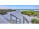 Picturesque beach access with wooden steps leading to the pristine sandy shore and sparkling ocean at 4401 Gulf Of Mexico Dr # 907, Longboat Key, FL 34228
