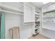 Organized walk-in closet features custom shelving and storage solutions for clothing, linens, and accessories at 4401 Gulf Of Mexico Dr # 907, Longboat Key, FL 34228