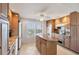 Modern kitchen with granite countertops, stainless steel appliances, and a view of the ocean at 4401 Gulf Of Mexico Dr # 907, Longboat Key, FL 34228