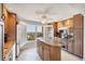 Well-lit kitchen features an island, modern appliances, and a window with an ocean view at 4401 Gulf Of Mexico Dr # 907, Longboat Key, FL 34228