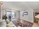 Cozy living room with access to balcony, offering incredible ocean views, perfect for relaxation and entertainment at 4401 Gulf Of Mexico Dr # 907, Longboat Key, FL 34228