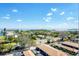 Scenic view of neighborhood streets, tropical landscaping, and distant waterways and islands at 4401 Gulf Of Mexico Dr # 907, Longboat Key, FL 34228