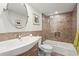 Cozy bathroom with ceramic tile surround, a single vanity, and bathtub with wall-mounted shower head at 4600 Gulf Of Mexico Dr # 201, Longboat Key, FL 34228