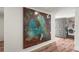 Hallway featuring wood flooring, large modern art, and doorway to laundry area at 4600 Gulf Of Mexico Dr # 201, Longboat Key, FL 34228