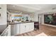 Bright, open kitchen featuring modern stainless steel appliances and countertop seating at 4600 Gulf Of Mexico Dr # 201, Longboat Key, FL 34228