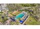 Inviting community pool area with lounge chairs, umbrellas, and lush landscaping at 4600 Gulf Of Mexico Dr # 201, Longboat Key, FL 34228
