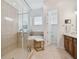 Bathroom with walk-in shower, tub, and granite vanity, with tile throughout at 471 Gilman N Ct, St Petersburg, FL 33716