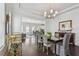 Chic dining area featuring an open floor plan perfect for entertaining with views into living area at 471 Gilman N Ct, St Petersburg, FL 33716