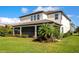 A spacious backyard with a screened-in patio and lush landscaping at 4881 Antrim Dr, Sarasota, FL 34240