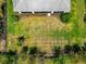 A sprawling backyard features a lush lawn and tropical landscaping at 4881 Antrim Dr, Sarasota, FL 34240