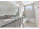 This bathroom is well-lit and features a granite countertop at 4881 Antrim Dr, Sarasota, FL 34240