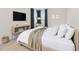 Comfortable bedroom with neutral walls and large windows, providing natural light and a relaxing atmosphere at 4881 Antrim Dr, Sarasota, FL 34240