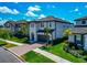 Lovely two-story home boasting a two-car garage, brick paved driveway, and lush green lawn at 4881 Antrim Dr, Sarasota, FL 34240