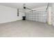 Spacious two-car garage with epoxy flooring and modern insulated garage door at 4881 Antrim Dr, Sarasota, FL 34240