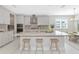 An elegant kitchen with stainless appliances, island, and seating at 4881 Antrim Dr, Sarasota, FL 34240